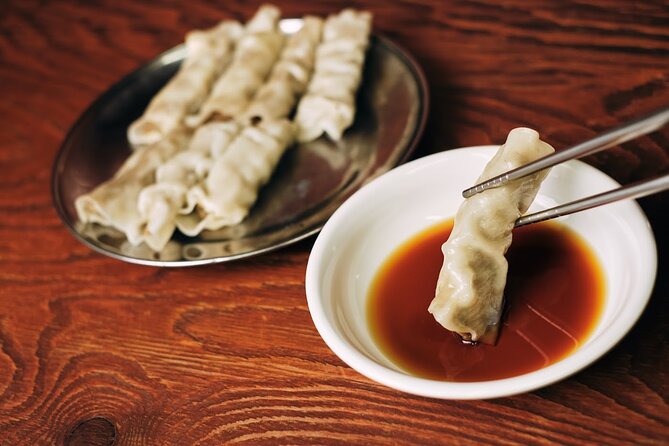 Private Downtown Seoul Food & Market Tour with 8+ Tastings - Namdaemun Market by the Great South Gate: eat where everyday Seoul shops